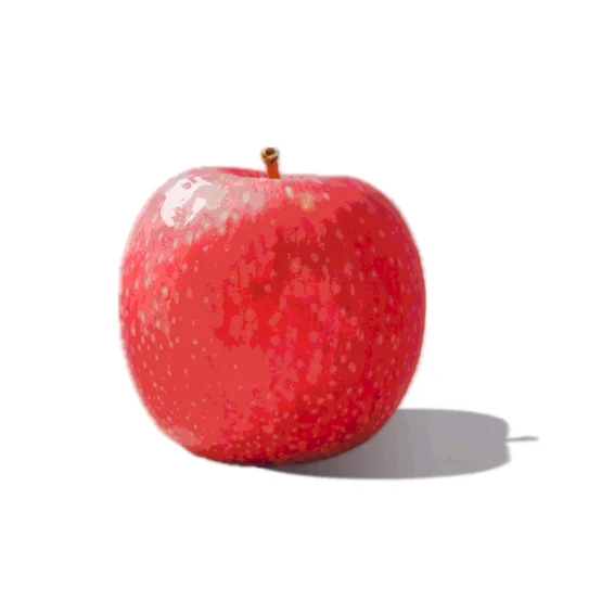 A fuji apple infront of a white backdrop with studio light. A small face is disguised in apple's white highlights.